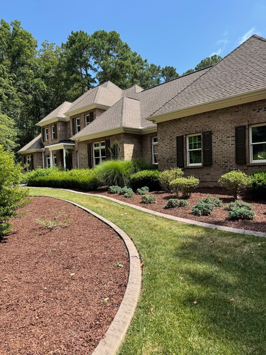 Manicured lawn and beds